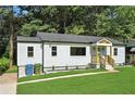 Attractive home exterior with a well-maintained lawn and neat landscaping at 1227 Kenilworth Dr, Atlanta, GA 30310