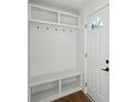 Bright mudroom with built-in storage bench and coat hooks at 1227 Kenilworth Dr, Atlanta, GA 30310