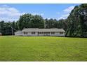 Single story home on a large lot with lush lawn and mature trees offering country living at 95 Oak Grove Cir, Mcdonough, GA 30253