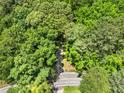 Aerial view of the road leading to the wooded property at 1975 Mack Rd, Douglasville, GA 30135
