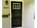 Inviting front door with glass insert, traditional hardware, and house number display at 6471 Ansley Blvd, Lithia Springs, GA 30122