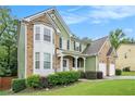 Attractive exterior view showcasing the home's architecture, landscaping, and inviting curb appeal at 157 Spur Ln, Hiram, GA 30141