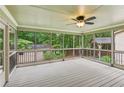 Inviting screened porch with wooded views, offering a relaxing outdoor living space at 1420 Pilgrim Rd, Cumming, GA 30040