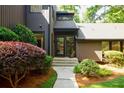 Inviting front entrance with lush landscaping and a pathway leading to the double front doors at 1510 Chevron Dr, Sandy Springs, GA 30350