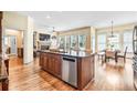 Open kitchen featuring an island with granite countertop and stainless steel appliances, blending style with functionality at 2953 Kings Walk Ave, Marietta, GA 30062