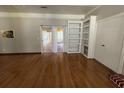 Living room features hardwood floors, built-in shelving, and sliding glass doors to the outside at 2807 Mcclave Dr, Doraville, GA 30340