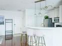 Kitchen bar offers seating and features modern pendant lighting and stainless appliances at 400 17Th Street Nw # 2313, Atlanta, GA 30363