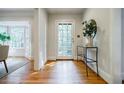 Inviting foyer with hardwood floors, a stylish console table, and a bright, welcoming atmosphere at 2007 Mount Vernon Pl, Dunwoody, GA 30338