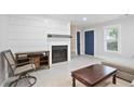 Cozy living room features a fireplace, neutral tones, and ample natural light at 4167 Oakwood Way, Duluth, GA 30096