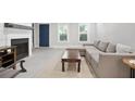 Inviting living room features neutral colors, a fireplace, and comfortable seating at 4167 Oakwood Way, Duluth, GA 30096