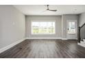 Inviting living room boasting hardwood floors, ample natural light, and a contemporary ceiling fan at 1947 Drew Nw Dr, Atlanta, GA 30318