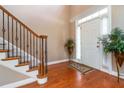 Elegant foyer with hardwood floors, staircase, and natural light streaming in from the front door at 739 E Mays E Rd, Stockbridge, GA 30281
