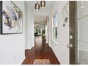 Inviting entryway with wood floors and a modern light fixture at 1399 Flathead River Ln, Marietta, GA 30064