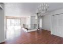 Bright living area with wood floors, a chandelier, and sliding glass doors at 1213 Camelot Dr, Atlanta, GA 30349