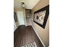 Inviting entryway featuring wood flooring and decorative wall art at 1346 Pilgrim Lake Dr, Cumming, GA 30040