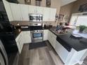 Well-equipped kitchen with stainless steel appliances and ample counter space at 1346 Pilgrim Lake Dr, Cumming, GA 30040