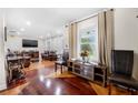Open-concept living room with stylish hardwood floors and a neutral color palette at 2021 Sherwood Dr Se, Marietta, GA 30067