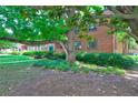 Brick building with mature shade tree and lush landscaping at 1400 Chalmette Ne Dr # 2, Atlanta, GA 30306