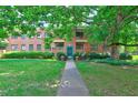 Classic brick building surrounded by mature trees and lush lawn at 1400 Chalmette Ne Dr # 2, Atlanta, GA 30306