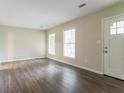 An empty room with wood floor and lots of natural light at 1496 Indian Forest Ct, Stone Mountain, GA 30083