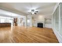 Expansive living room features hardwood floors, fireplace, and open floor plan at 4742 Legacy Cove Ln, Smyrna, GA 30126
