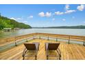 Dock featuring lounge chairs and lake view ideal for relaxing by the water at 627 Apache Trl, Woodstock, GA 30189