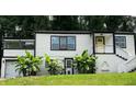 Inviting home with fresh landscaping and a bright yellow door at 2170 Beecher Sw Cir, Atlanta, GA 30311