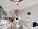 Bright living room open to the kitchen features contemporary decor and hardwood floors at 458 Connally Se St, Atlanta, GA 30312