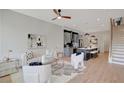 Bright living room open to the kitchen features contemporary decor and hardwood floors at 458 Connally Se St, Atlanta, GA 30312