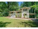 Charming home with brick exterior, shutters, manicured lawn, and inviting front entrance at 481 Meadowbrook Se Dr, Marietta, GA 30067