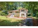 Charming home with brick exterior, shutters, manicured lawn, and inviting front entrance at 481 Meadowbrook Se Dr, Marietta, GA 30067