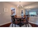 Charming dining area with a round table, seating for four, and view to the kitchen at 6851 Roswell Rd # G3, Atlanta, GA 30328