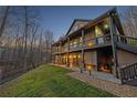 Exterior shot of a two-story house with a wraparound porch at dusk at 101 Bevil Ridge Se Rd, Emerson, GA 30137