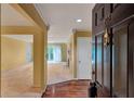 Inviting home foyer featuring hardwood floors, neutral walls, and ample natural light, leading to spacious living areas at 26303 Plantation Ne Dr # 303, Atlanta, GA 30324