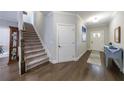 Spacious foyer with wood floors and natural light leading to the staircase at 3018 Patriot Square, Marietta, GA 30064