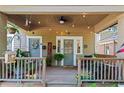 Inviting front porch with string lights, plants, and decor, creating a cozy outdoor space at 210 Evans Dr, Decatur, GA 30030
