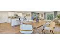 Open-concept dining room featuring stylish furnishings and seamless flow into the kitchen area at 5455 Baybrook Cir, South Fulton, GA 30349