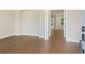 Foyer with light-colored walls and warm-toned hardwood flooring and views to other rooms at 2545 Bertrand Way, Cumming, GA 30041