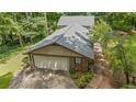 Charming house with attached garage and mature landscaping and trees at 5632 Stillwater Ct, Stone Mountain, GA 30087