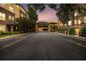 Exterior view of community parking garage with manicured landscaping at 10 Perimeter Summit Ne Blvd # 4223, Brookhaven, GA 30319