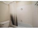 Bathroom showcasing a standard bathtub with white tile surround and neutral shower curtain at 1150 Collier Nw Rd # 10L, Atlanta, GA 30318