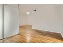 Bright bedroom with natural hardwood floors, white walls, and neutral trim at 1150 Collier Nw Rd # 10L, Atlanta, GA 30318