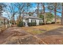 Quaint single-Gathering home showcasing a tidy front yard and convenient driveway at 1222 E Forrest Ave, Atlanta, GA 30344