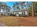 Delightful one-story home with a neat front yard and a peaceful neighborhood setting at 1222 E Forrest Ave, Atlanta, GA 30344
