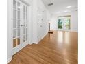 Bright living room featuring hardwood floors, fireplace, and french doors leading to an outdoor balcony at 238 Balsam Dr, Canton, GA 30114