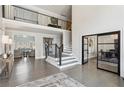 Grand foyer features hardwood floors, staircase, and an open view to the living spaces at 1460 Lakemist Ct, Roswell, GA 30075