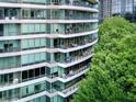 Exterior shot showcases multiple private balconies with furniture, perfect for enjoying outdoor living at 700 Park Regency Ne Pl # 805, Atlanta, GA 30326