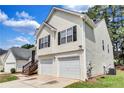 Classic two-story home features a two-car garage and inviting front entry at 2169 Wingfoot Pl, Decatur, GA 30035
