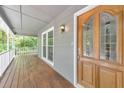 Inviting front porch boasts a beautiful wood door and ample space for relaxing at 405 W Leslie Ct, Woodstock, GA 30188