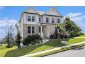 Two-story home with brick and siding, landscaped lawn on a beautiful sunny day at 25 Running Terrace Way, Cartersville, GA 30121